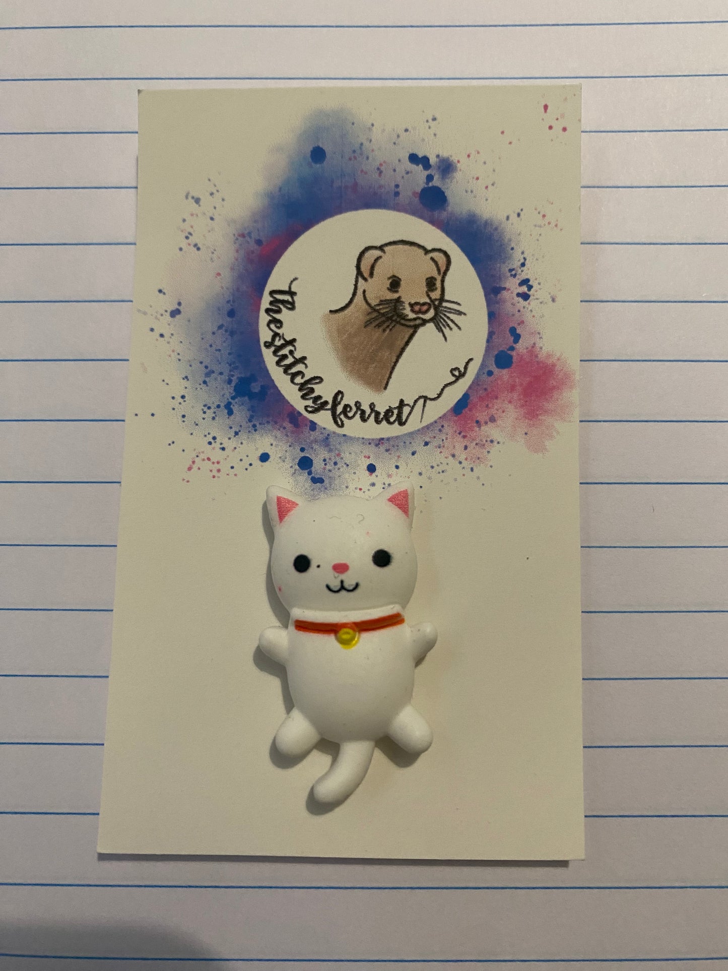 White cat needle minder